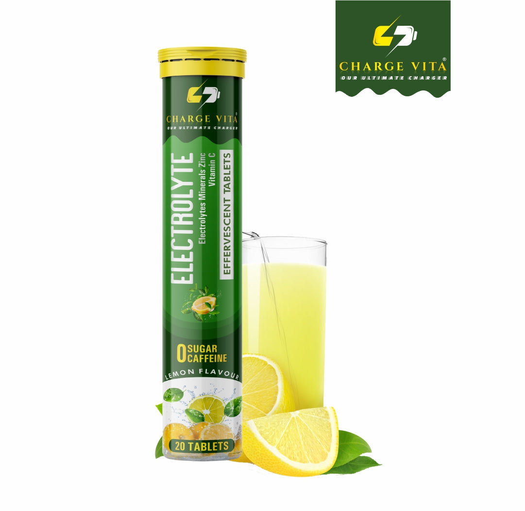 Tube of Charge Vita Electrolyte tablets with a glass of lemon juice and lemon slices on a white background.